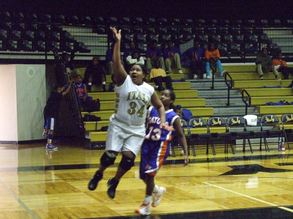 Image: Khadijiah Davis — Italy’s #34 Khadijiah Davis soars to the goal helping to rackup a win for the Lady Gladiators JV.