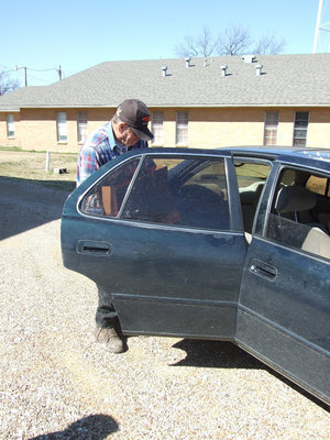 Image: Bill Youngblood — Bill loads the food into the car for the pantry customers.