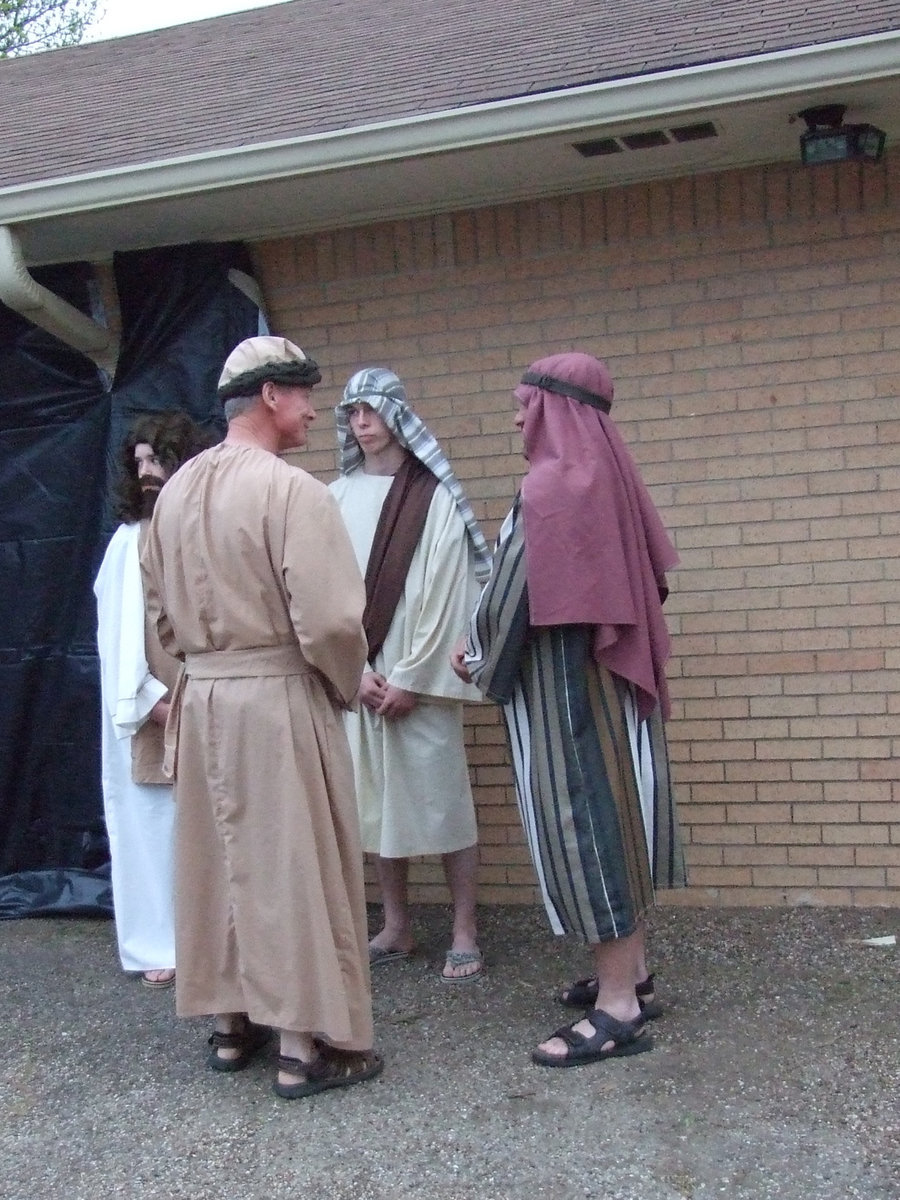 Image: Guests with Jesus — The master of ceremonies with Jesus and the guests.