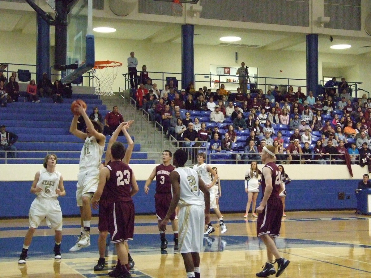 Image: Hopkins rebounds — Italy sophomore, Cole Hopkins, out jumps the Eagles.