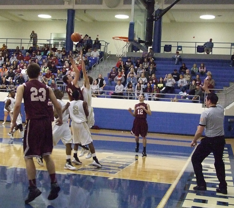 Image: Tough defense — Gladiators Brandon Souder(15) and Heath Clemons(2) put pressure on a Mildred shooter.