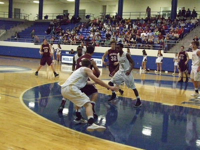 Image: Ashcraft goes for the steal — Heath Clemons(2) and Ryan Ashcraft(4) try to force an Eagle turnover.