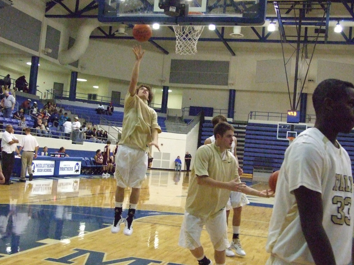 Image: Halftime — Italy’s Brandon Souder goes up during halftime practice.