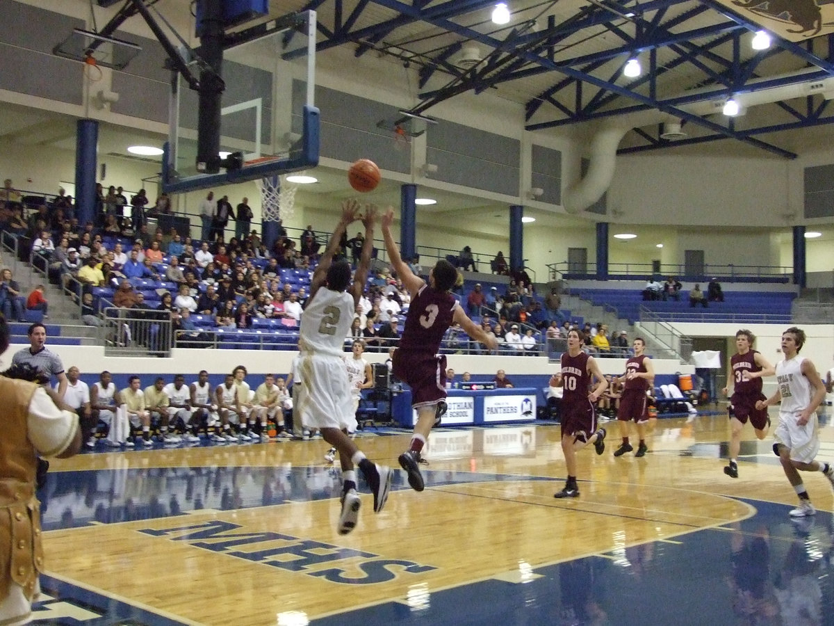 Image: Go, Heath, Go! — Heath Clemons(2) tries to haul a lob pass from the backcourt.