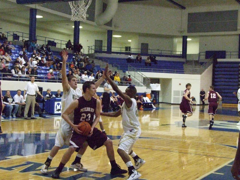 Image: Ashcraft and Sephus — Ryan Ashcraft(4) and De’Andre Sephus(20) go heavy on Mildred’s Nic Shimonek(23).