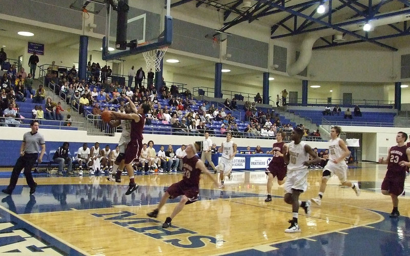 Image: Drawing Contact — Jasenio Anderson(11) found away against Mildred and took over in the second half.