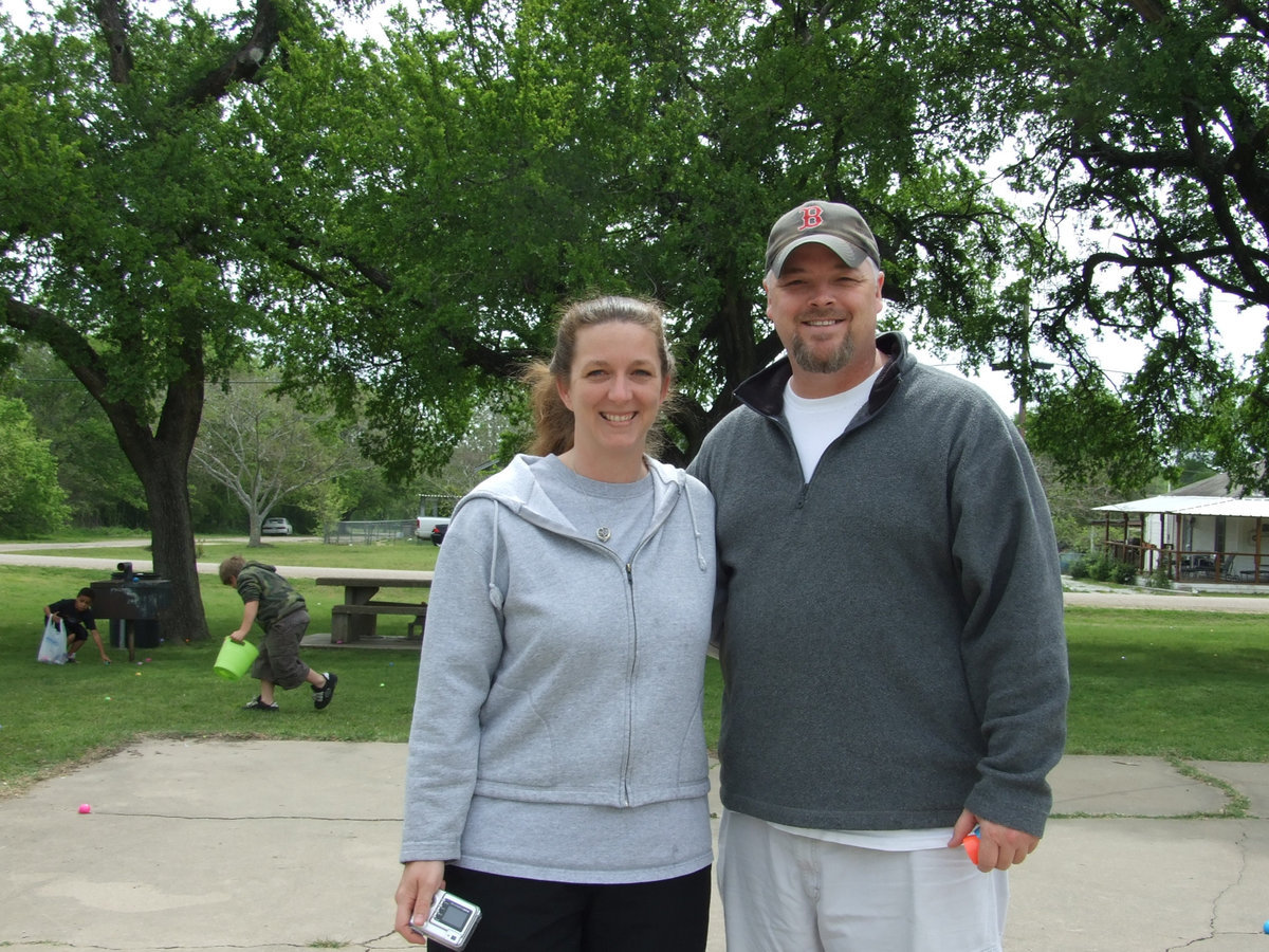 Image: Lets Have Fun — Shay Norcross and Steve Gilley (youth minister for First Baptist Church of Milford) are out helping the kids have a good time finding eggs.