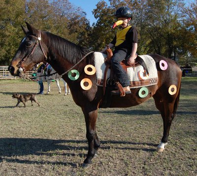 Image: Fruitiest — Hunter Hinz won the Fruitiest Fun costume as Tucan Sam and his horse Fruit Loops.