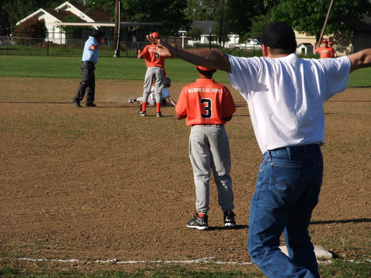 Image: He’s safe! — Coach Jason Escamilla calls Cody Boyd safe at second base. Fortunately, the umpire agreed with Jason’s assessment of the play.