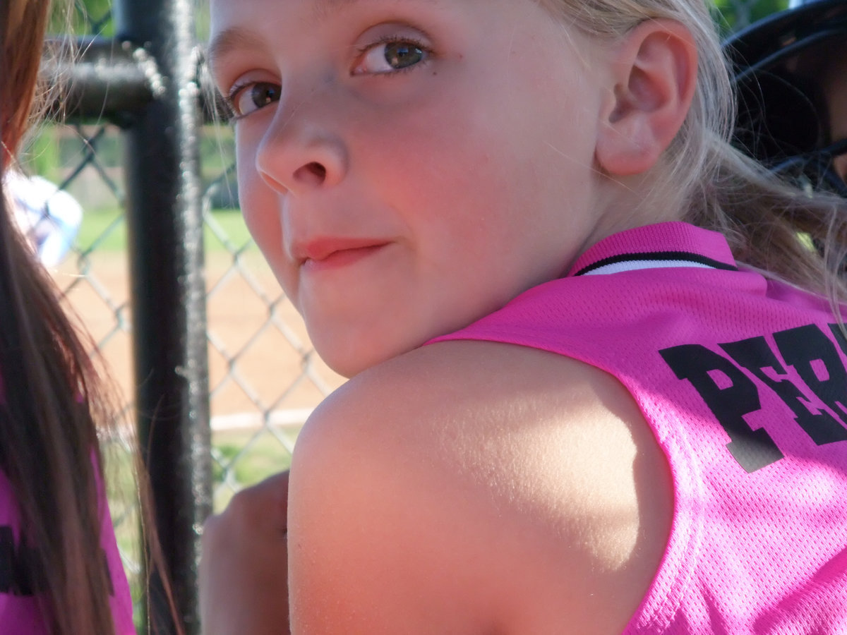 Image: Annie Perry — Annie Perry likes what she sees as she watches her Pink Panther team close out the win against Hillsboro.