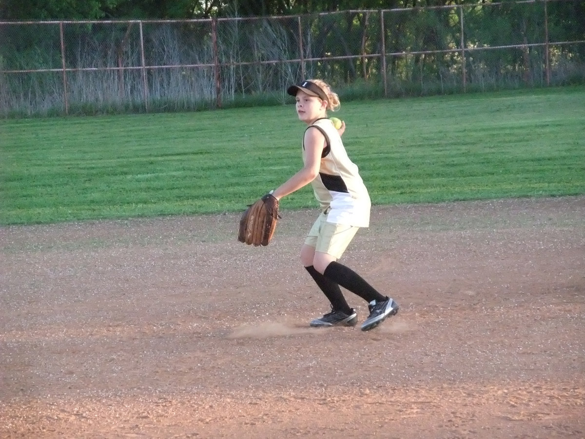 Image: Perry was prepared — Lillie Perry looked sharp at first base for Italy pulling off one of the plays of the game when she leaped for a high throw to first base and was able to, without looking, land on the base after the catch for the out.