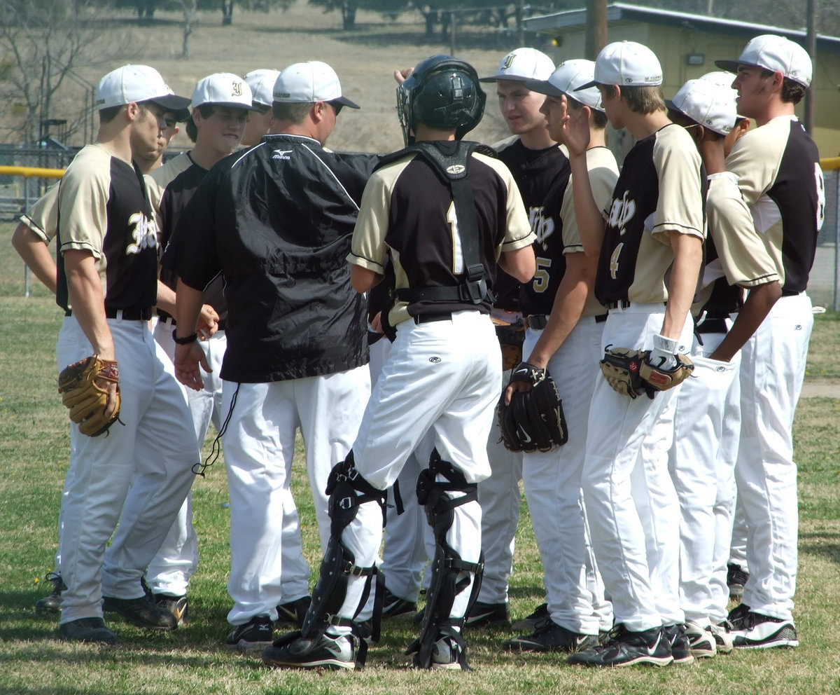 Image: The Gladiators battle — Coach Josh Ward and the Italy Gladiators gather up during the game against the Meridian Yellow Jackets.  The game was the first of the season. District play begins March 8 against Axtell.