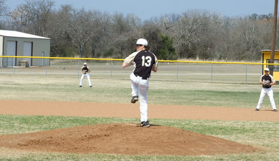 Image: Here’s the wind up — Justin (Buck) Buchanan (13) has been pitching since he was in elementary.