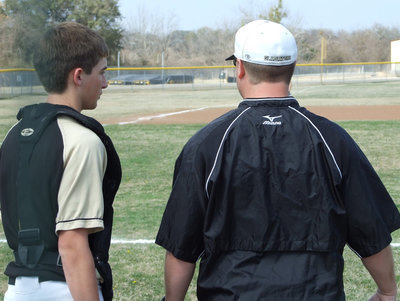 Image: Ross and Coach — Catcher Ross Stiles (1) and Coach Josh Ward go over the plan.