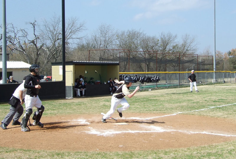 Image: Here we go, Buck — Justin Buchanan (13) gives a base hit.