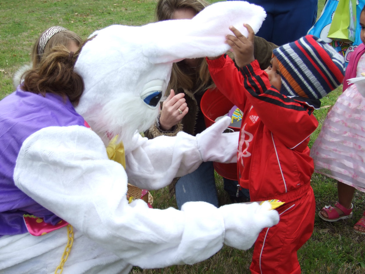 Image: Are Your Ears Real? — This cute little guy just loved the Easter Bunny’s ears!