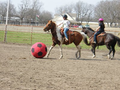 Image: ECEYA member Dakotah Van Huss and her horse Girlfriend take the ball down the arena.