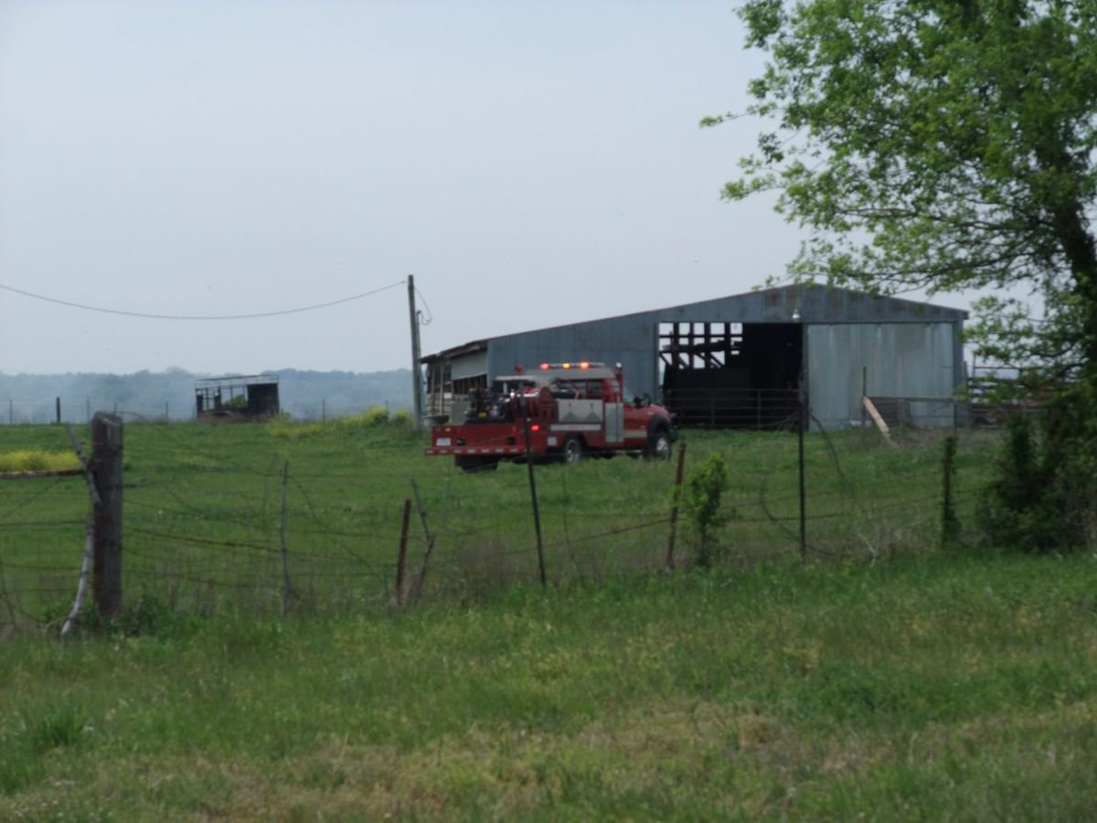 Image: Back peddling — The Italy Fire Department maneuvers through the back roads looking for another opening to get to the grass fire.