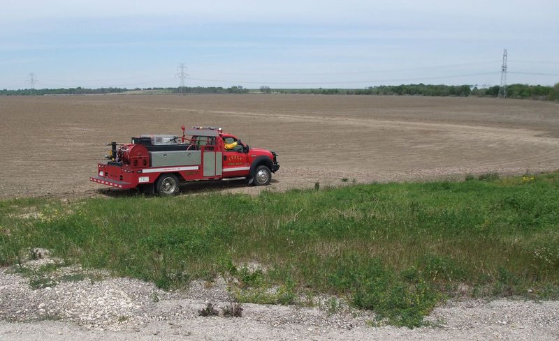 Image: Answering the bell — The Italy Brush 1 fire engine heads toward the source of the smoke.