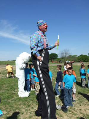 Image: Clown on Stilts — The students had fun listening to the funny clown!