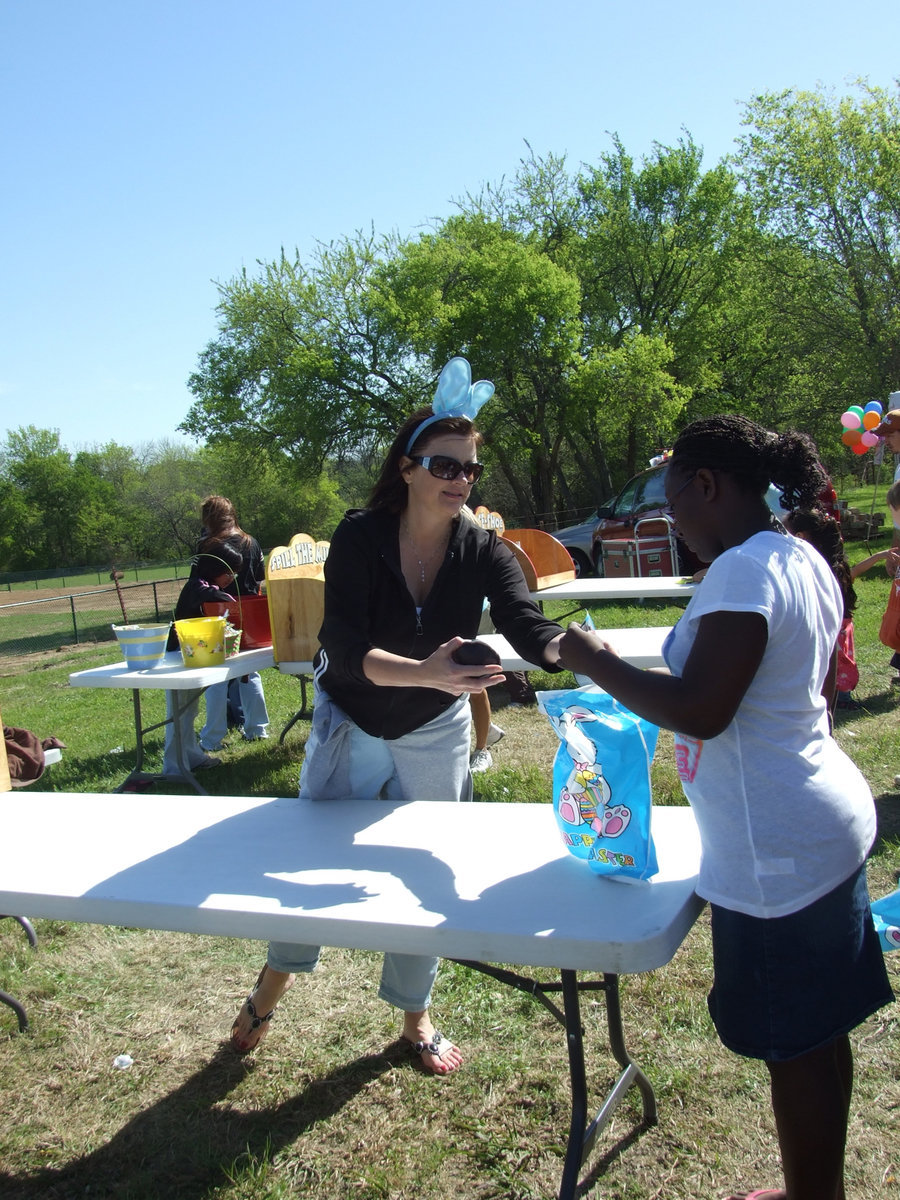 Image: Fun Prizes — She won the game and won a prize.