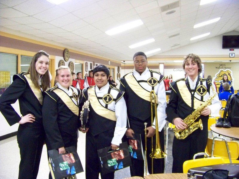 Image: Pre-preformance photo — Melissa Smithey, Drenda Burke, C.J. Enriquez, John Hughes and Joe Mac Pitts prepare for the Concert Band performance.