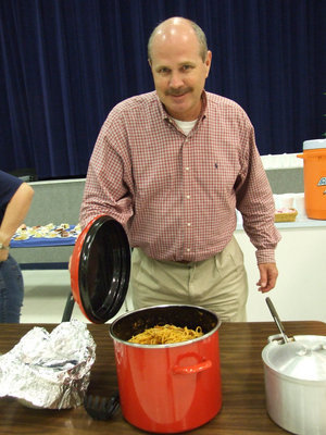 Image: What’s in This Pot? — Superintendent Don Clingenpeel checking out the covered dishes.