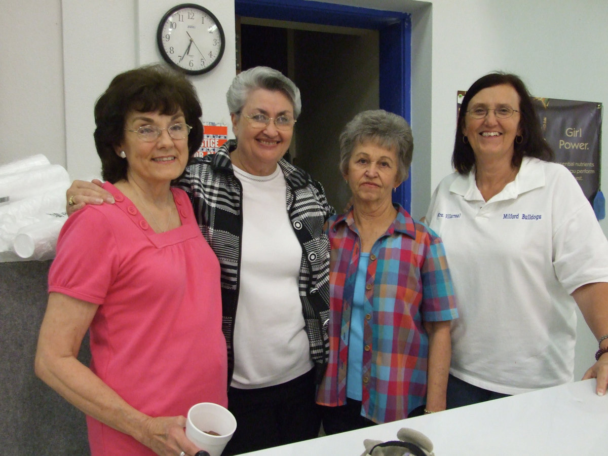 Image: Everyone is Working. — Joanne Dahl, Marilee Byrne (principal), Loraine Winchester, and Cindy Villarreal (3rd grade teacher) all having fun at the International Dinner.