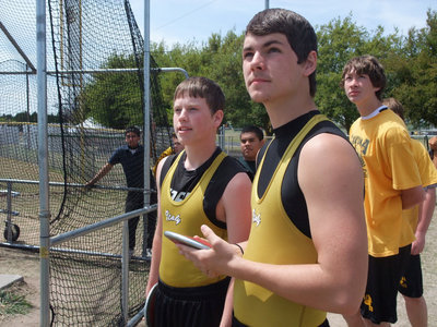 Image: Let it fly — Justin Buchanan and Jonathan Nash watch the discus fly from teammate Bobby Wilson’s hand. And they keep watching and watching…