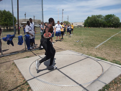 Image: Wilson spins — Bobby Wilson tries to break into the top spots in the discus event.
