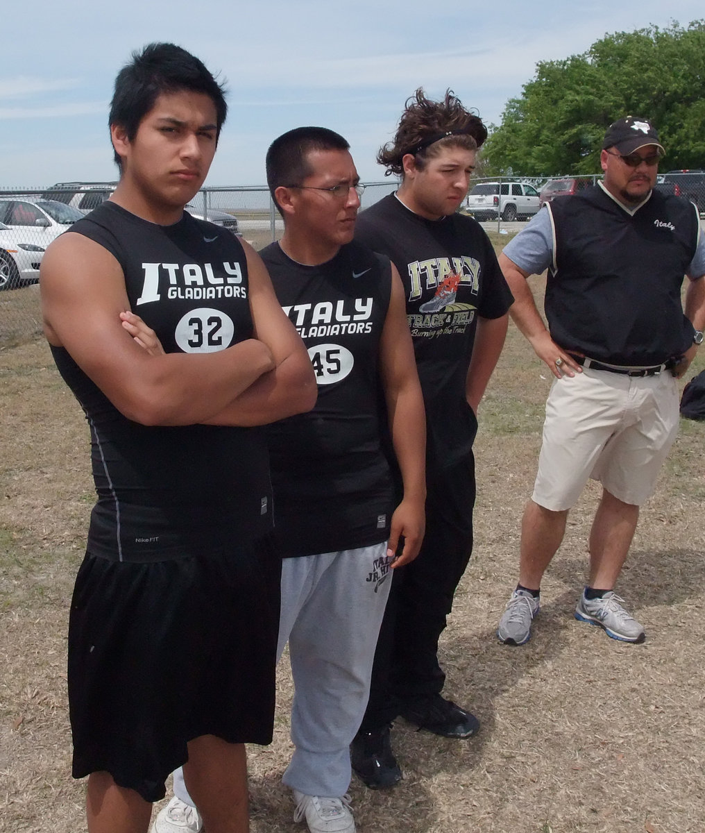 Image: Bales and the boys — Italy’s Junior Varsity shot putters Estrada, Lopez and Roldan are ready to unleash their fury.