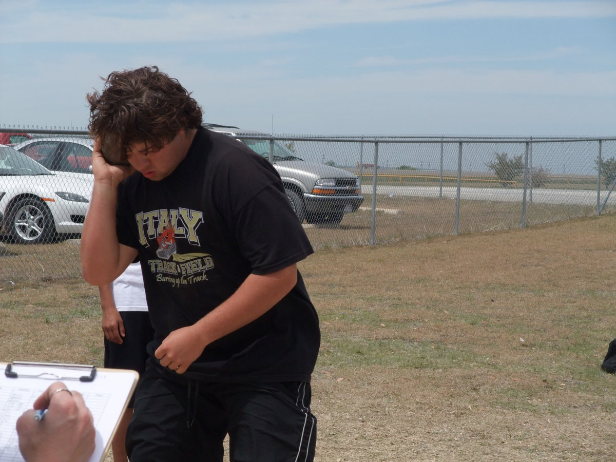 Image: Ivan settles in — Feeling the cold steel against his jaw, Ivan Roldan prepares to throw the shotput for the Gladiators.