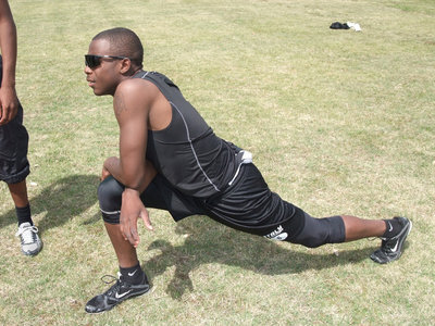 Image: Desmond stretches — Desmond stretches out the hams.