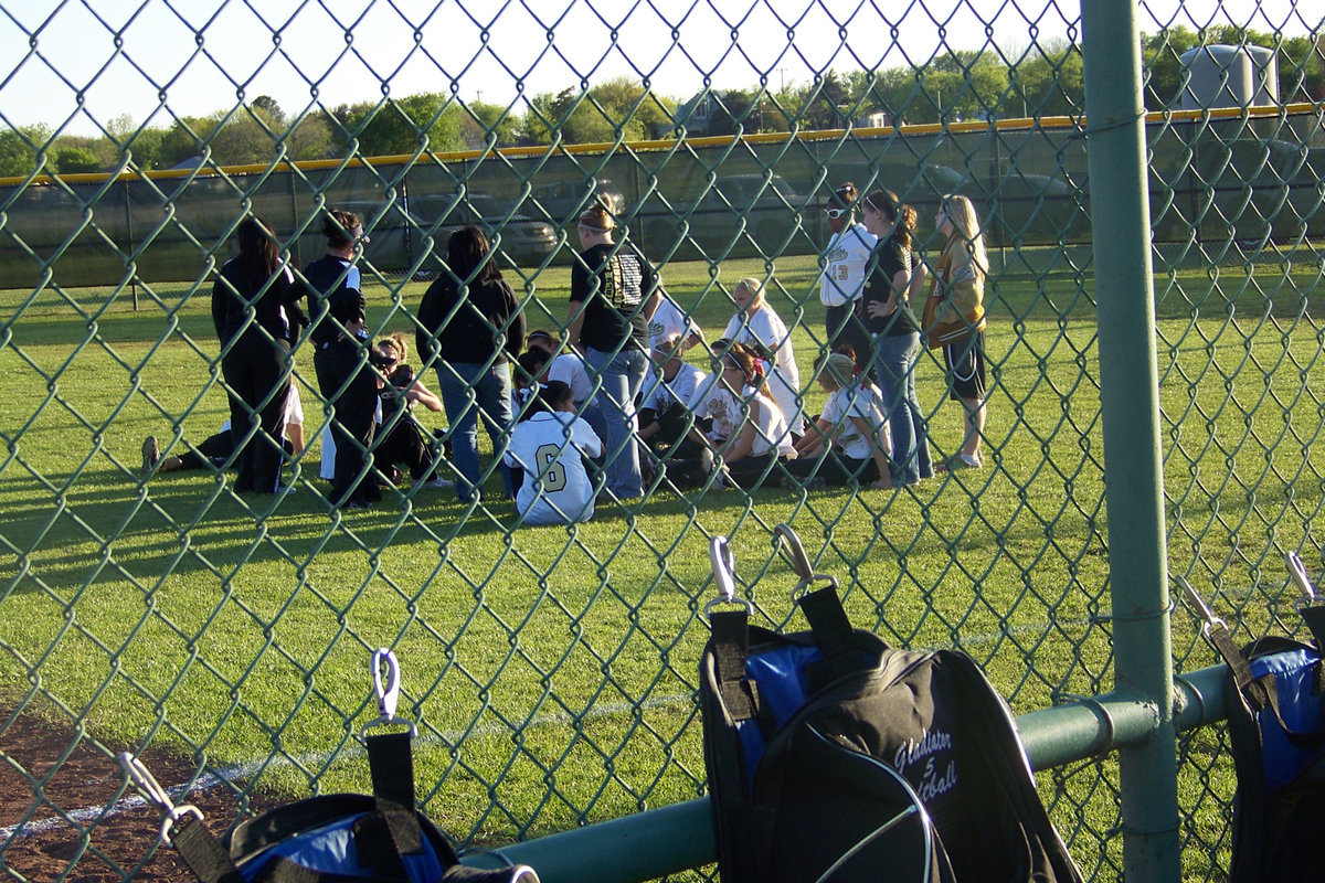 Image: Good words — Coaches praise the girls’ work after the game in the post game huddle.