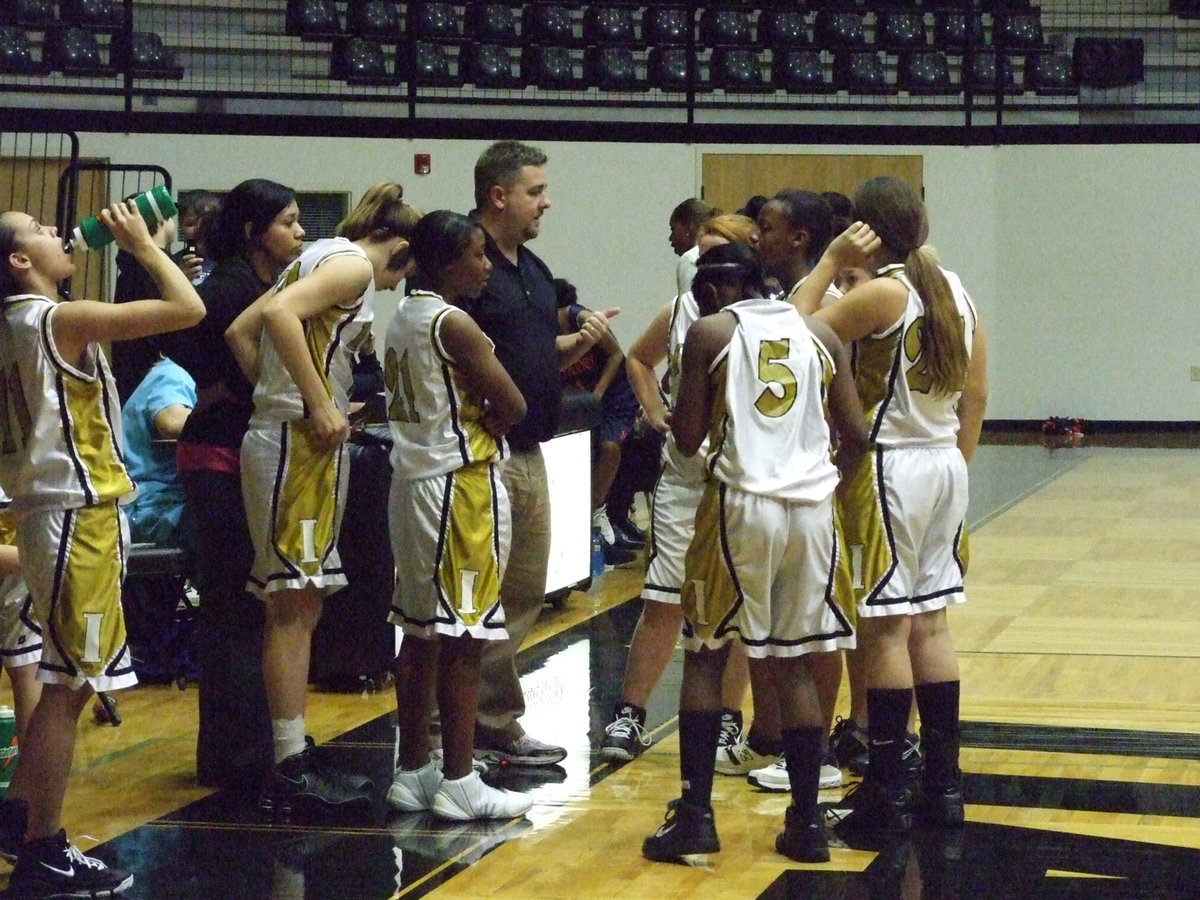 Image: Huddle Up — Head Coach Matt Coker talks strategy with the Italy girls.