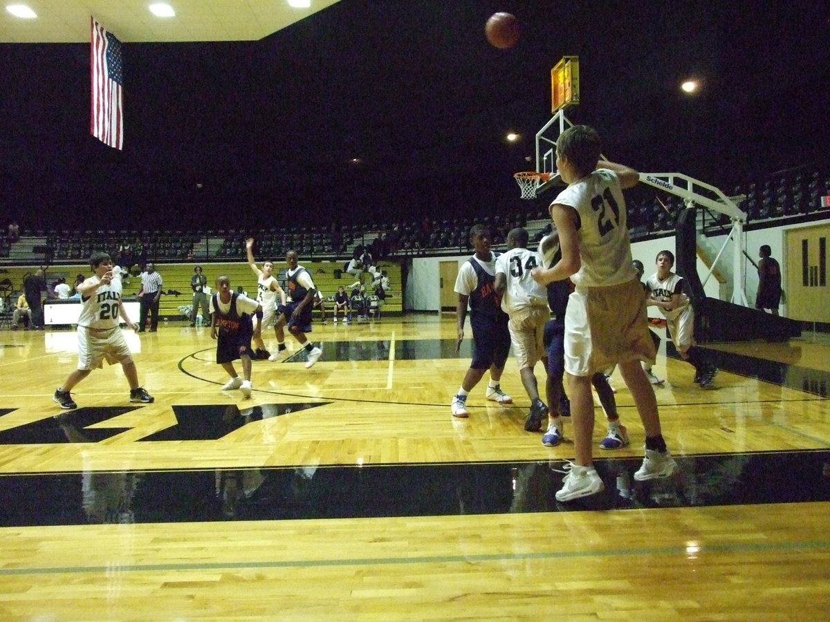 Image: Cole Passes — Cole Hopkins #21 attempts the dreaded cross-court pass to #4 Tony Wooldridge.