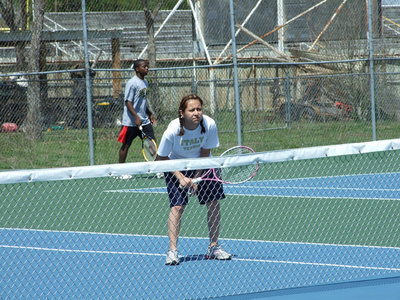 Image: Delma squints — Trying to squint some of that blur off the tennis ball is Delma Garcia.