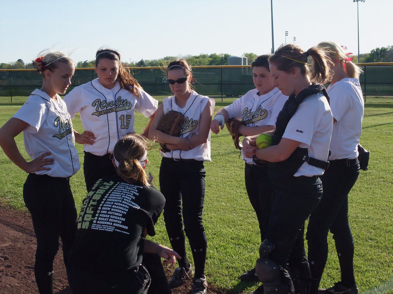 Image: Coach Reeves talks scenarios with the team — The Lady Gladiators matched up against Hubbard Friday night in Italy. Both teams were undefeated coming into the game and Hubbard was still undefeated when the dust had settled winning 9-0 over Italy.