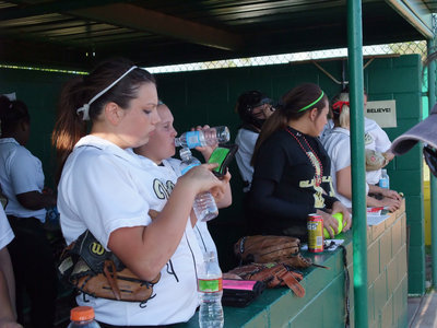Image: Digging in — Digging in, in the dugout, are the Lady Gladiators.