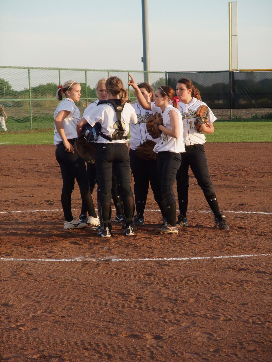 Image: Let’s do this! — The Lady Gladiators get each other ready to play some ball.