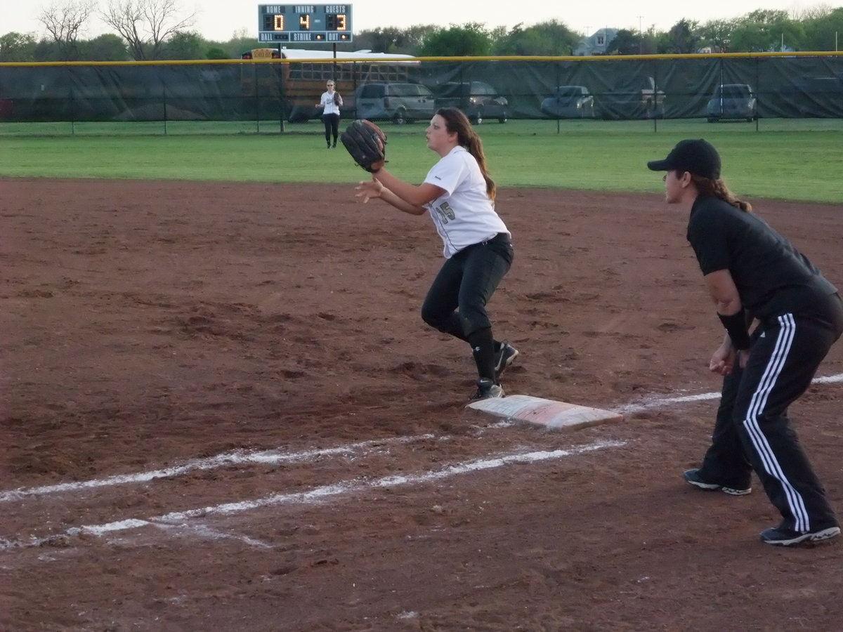 Image: Cori covers 1st — 2nd baseman Cori Jeffords covers 1st base while Drew Windham charged the bunt.