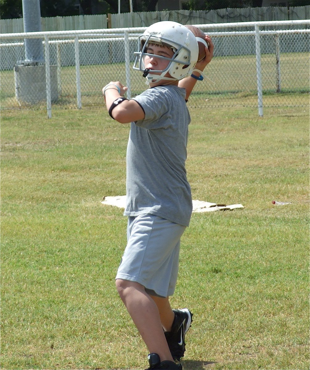 Image: Trying the arm — The 8th grade squad is loaded with talent to only have about twelve players on the roster.