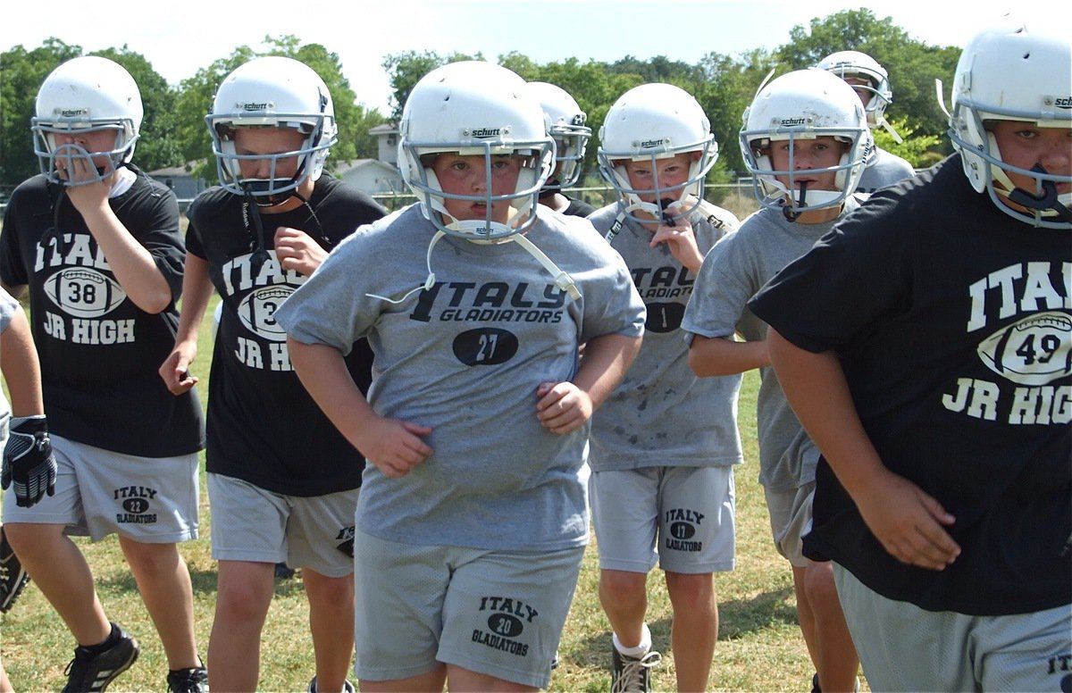 Image: Together, we can! — Here come the Italy Jr. High Gladiators.