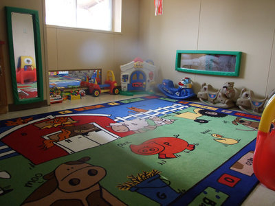 Image: Bright and cheery — The room is very inviting to the newborns and babies coming to visit.