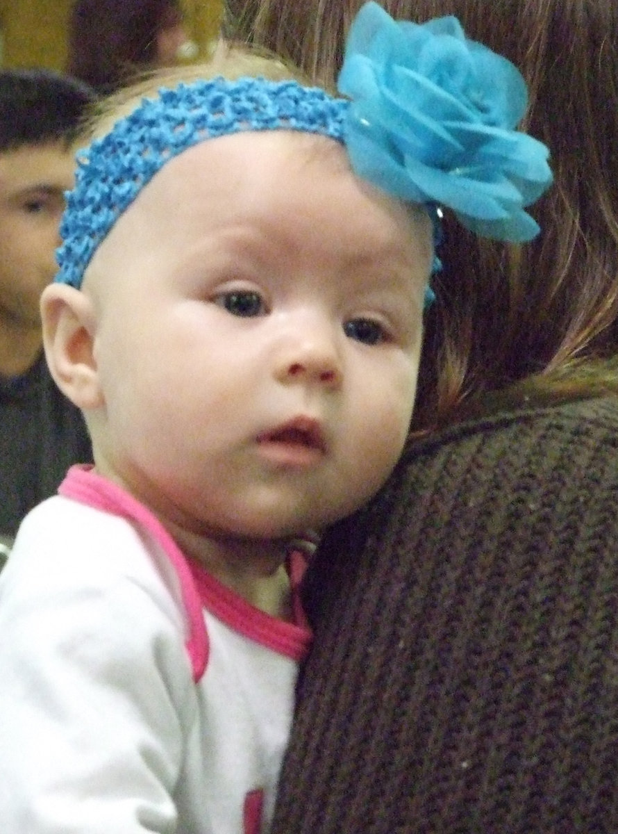 Image: Fire-woman in training — Lily Coers is happy to watch the festivities.