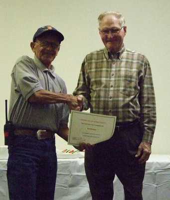Image: Sal Perales and Howard Morgan — Perales received a service award from Morgan.  Sal has served the fire department for 18 years.