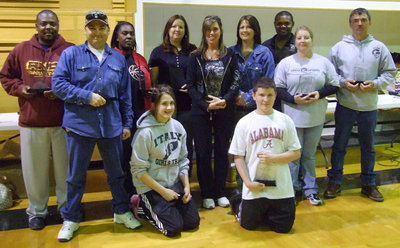Image: IYAA Parent &amp; Board Members — (L-R back row) Commissioner Glen McLendon, Jason Escamilla, Sandra Norwood, Michelle Walton, Tina Haight, Deborah Perry, Bryant Cochran, Misty Escamilla and Gary Wood.
    (L-R floor) Student volunteers Brianna Perry and Jake Escamilla. (Not pictured is Becky Boyd, Andi Hooker, Mickey Bland and Barry Byers)