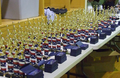 Image: Trophies galore — A sea of trophies await the excited hands of IYAA basketball participants.