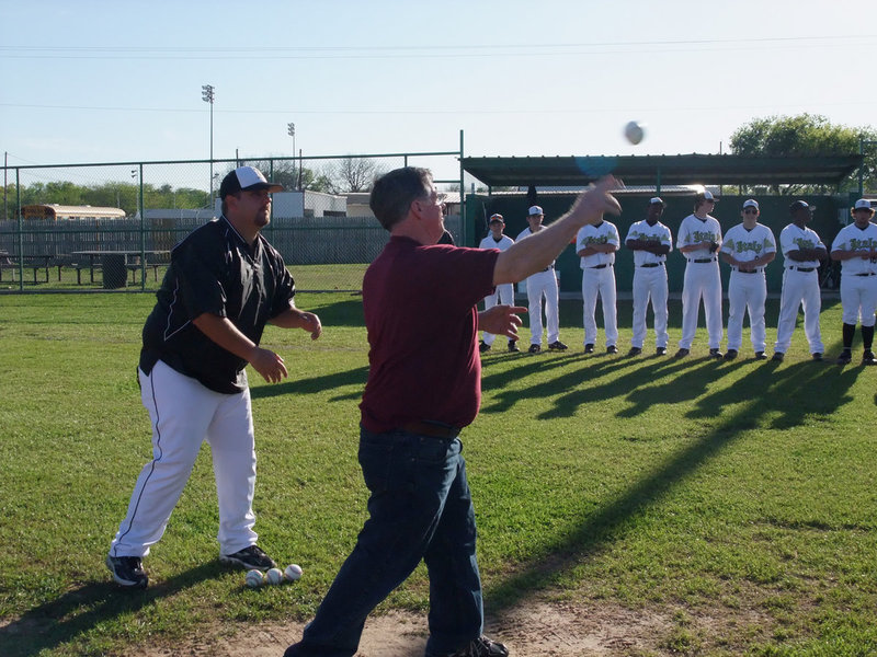 Image: David’s Supermarket — David’s Supermarket freezes the batter as Manager David Kelly throws out the opening pitch.