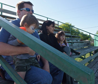 Image: Preparing to pitch — A nervous Mike South (representing italyneotribune.com), just moments before throwing out the opening pitch, enjoys the outing with his wife Tessa South and the little ones. Little Mikey South pitched on behalf of Monolithic Constructors, Inc.